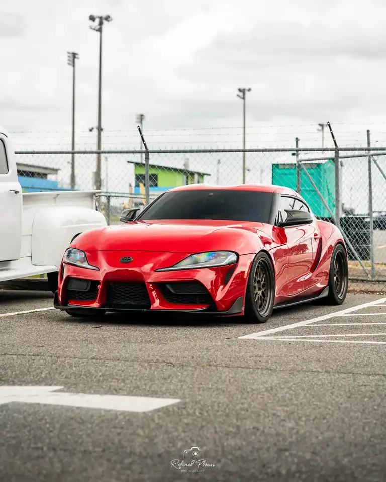 Red Toyota Supra in the paddock