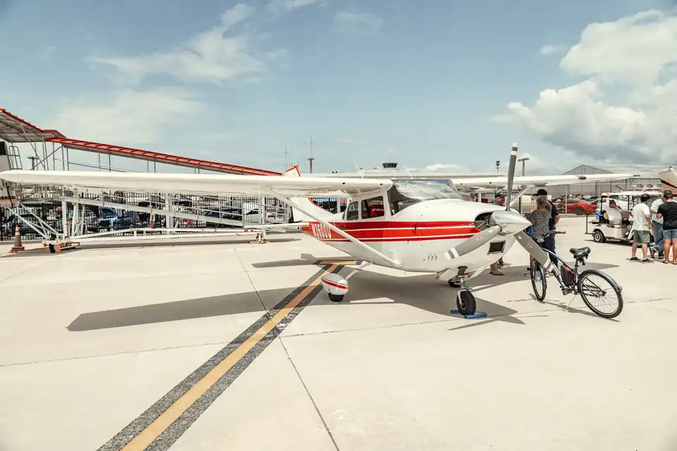 Red and white plane on the apron
