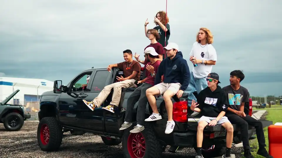 Crew on a lifted truck at the end of the day