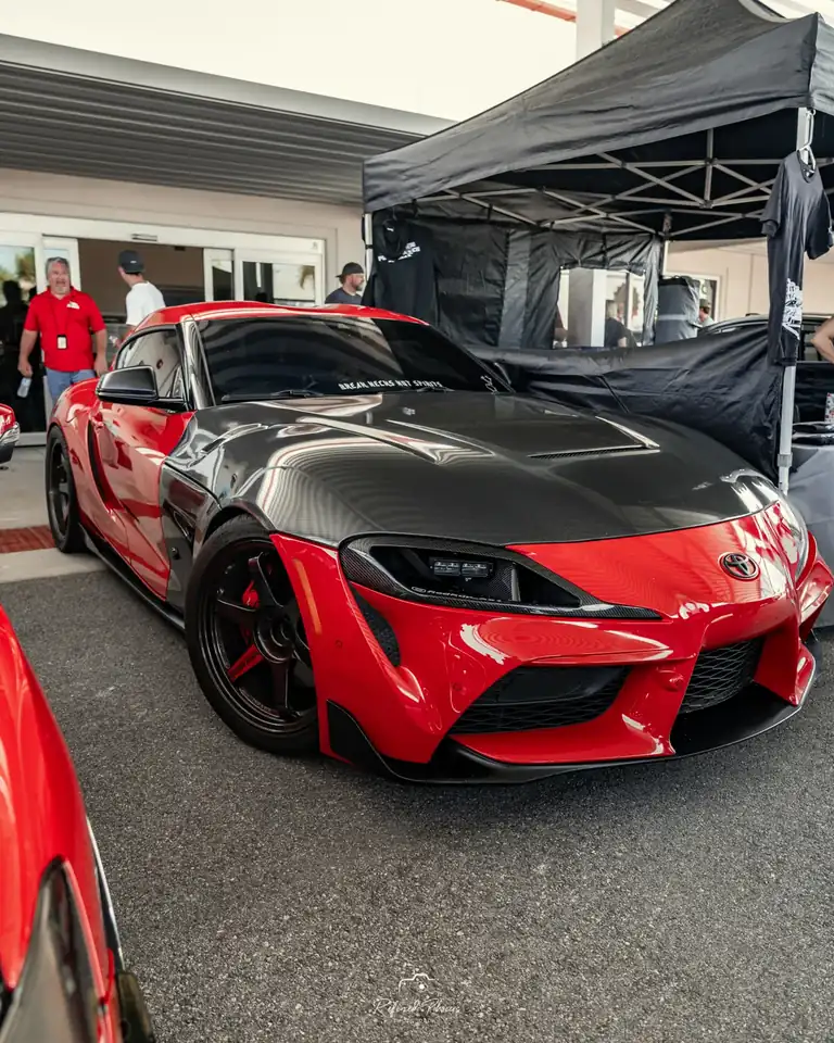 Red show car under the tent