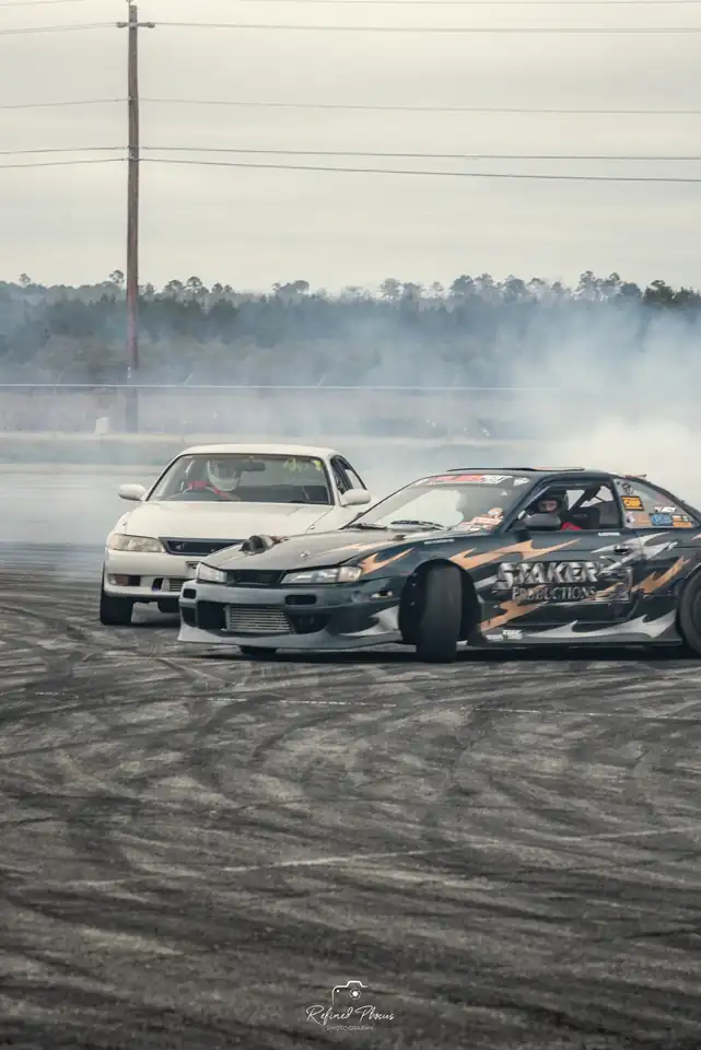 Two cars in a tandem slide